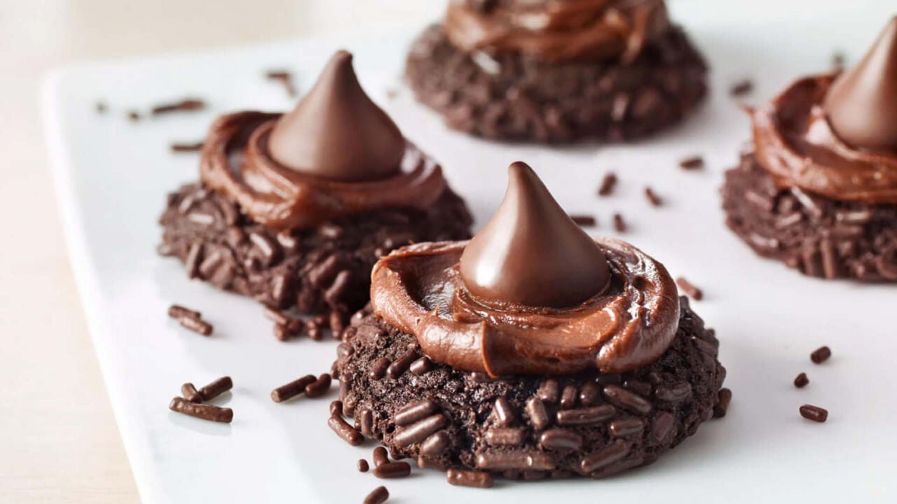 triple chocolate blossoms topped with chocolate frosting and hersheys kisses
