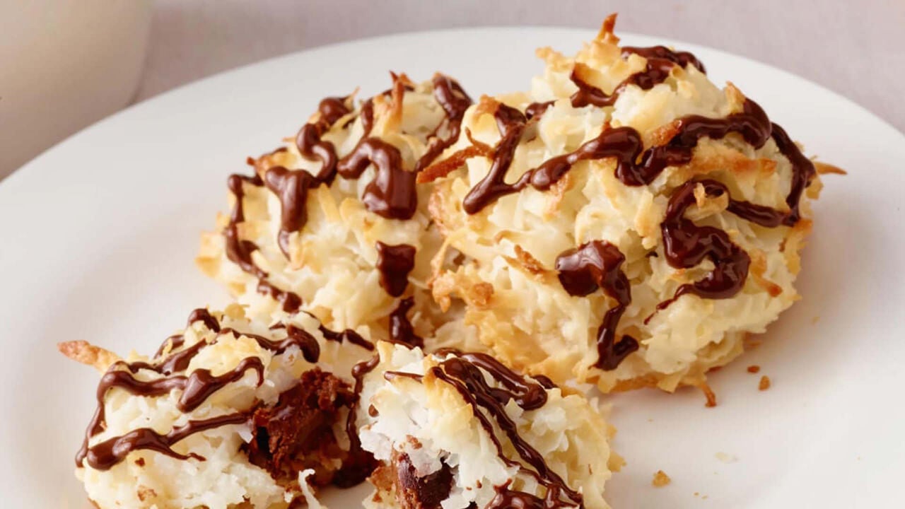 chocolate stuffed coconut macaroons topped with chocolate drizzle