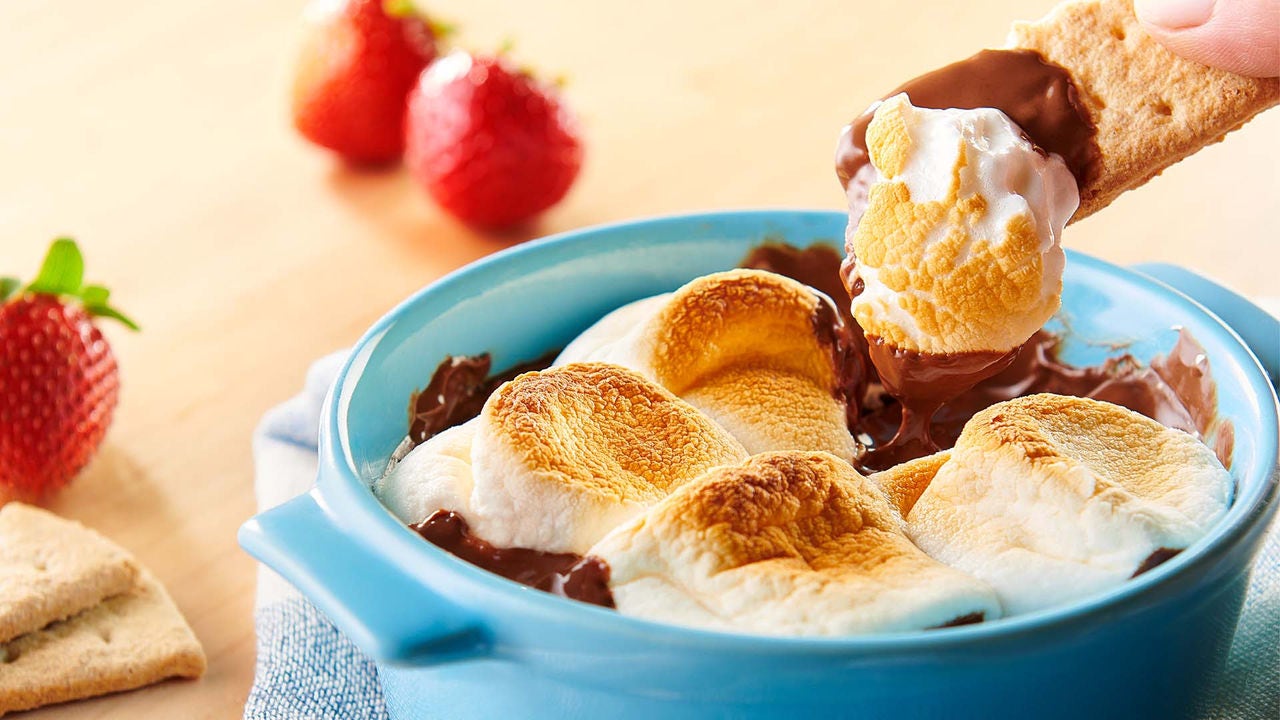 bowl of cookie dough smores dip with fresh strawberries