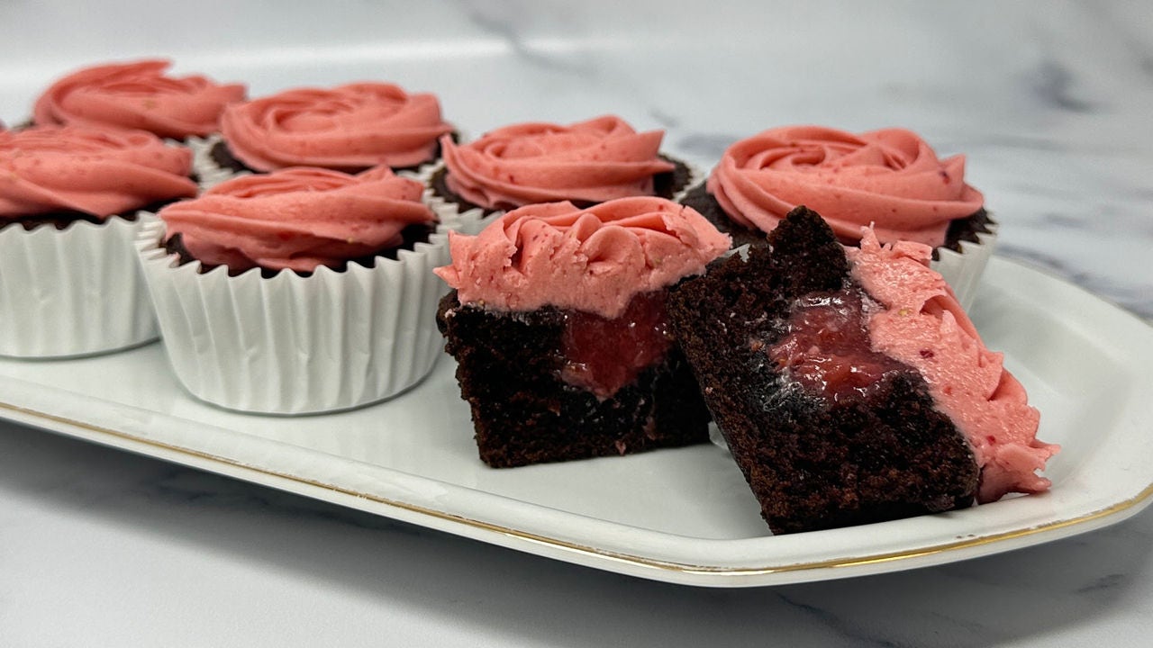 serving tray of chocolate covered strawberry cupcakes with pink frosting