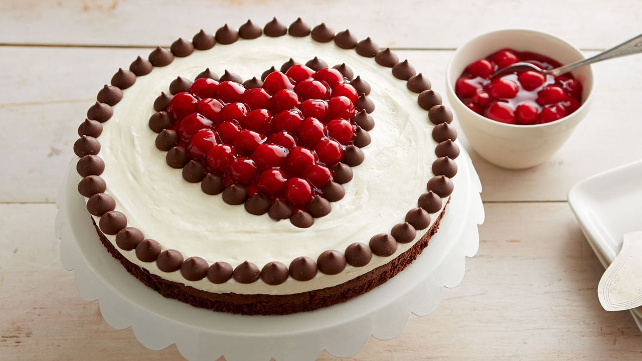 chocolate and cherries fudge torte with decorated with heart made from cherries and hersheys kisses