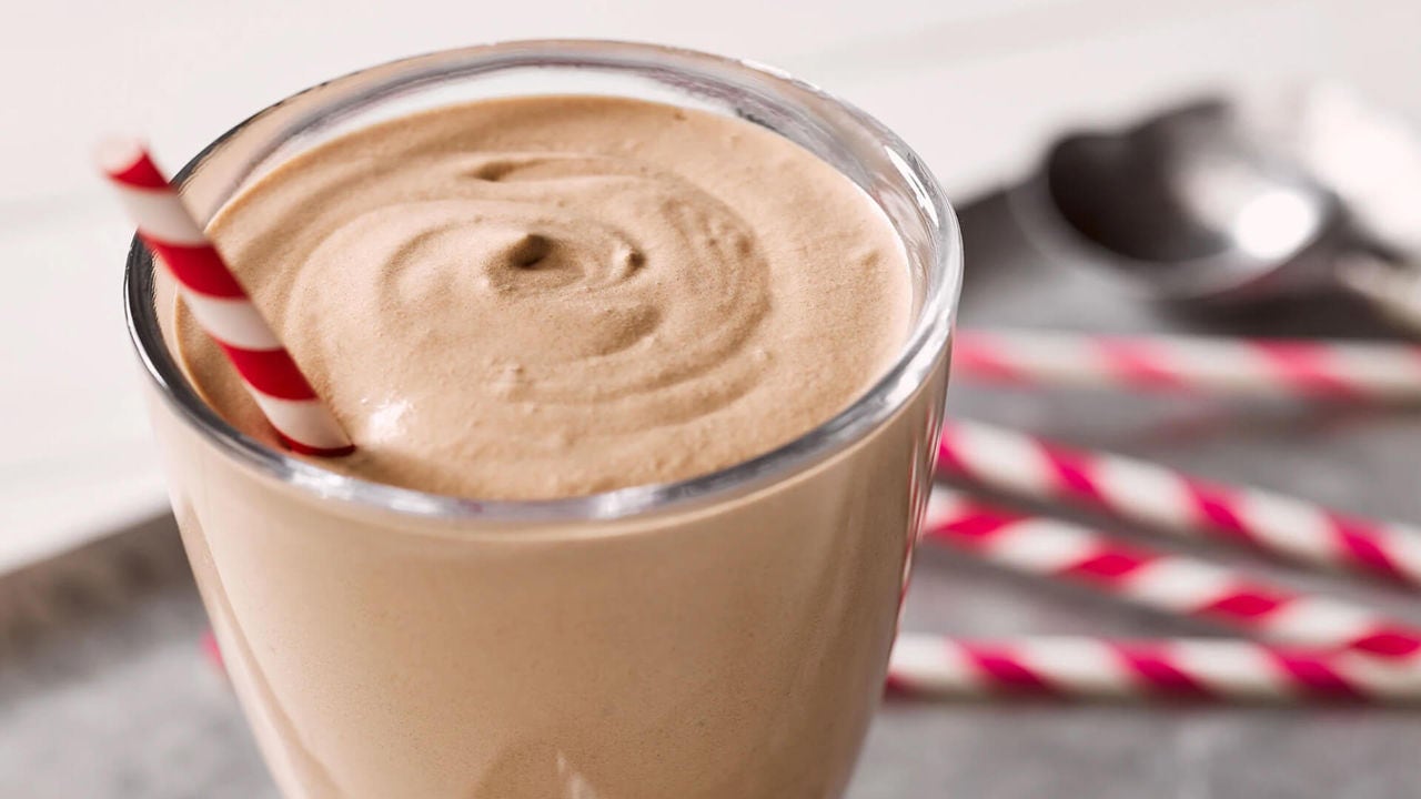 glass filled with hersheys chocolate milkshake