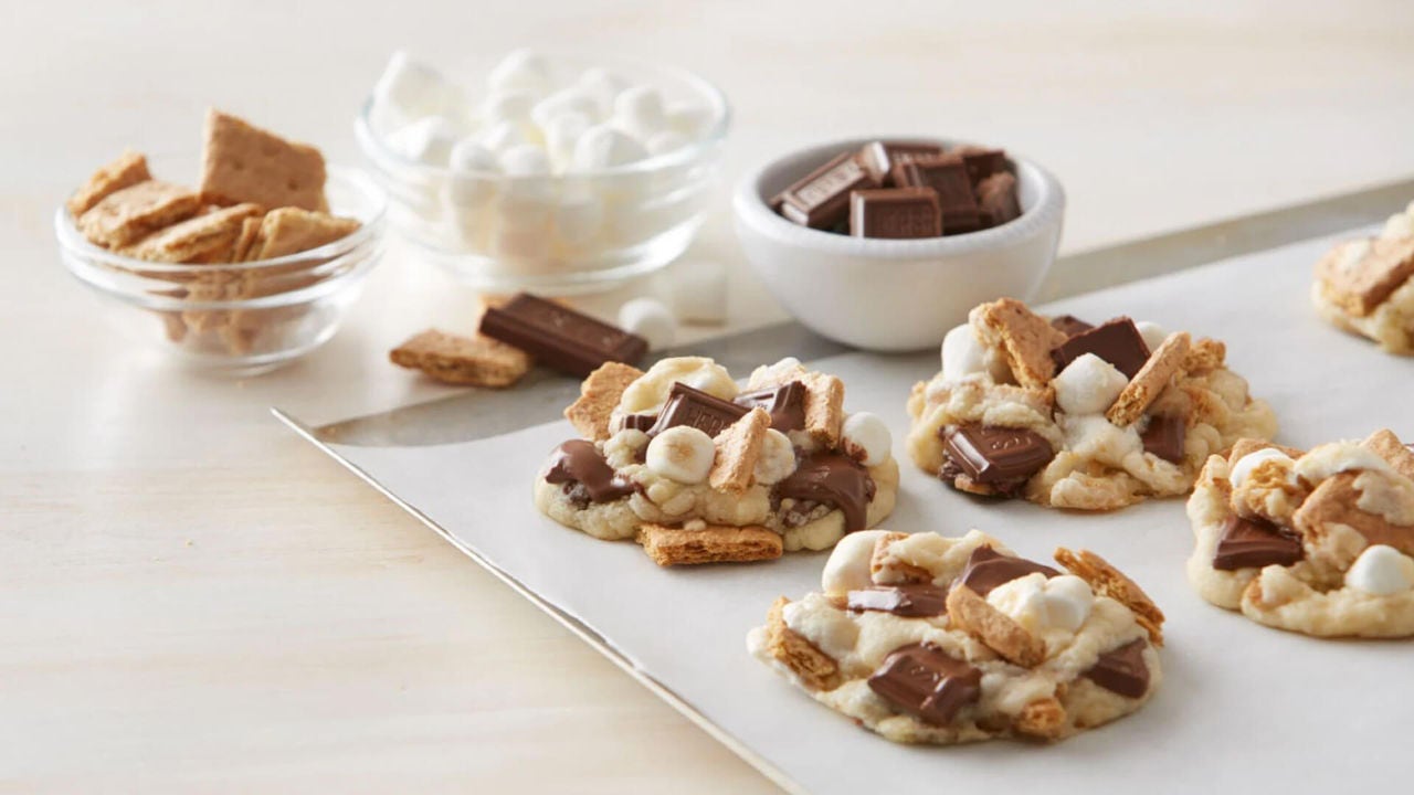 smores cookies on baking tray beside bowls of ingredients