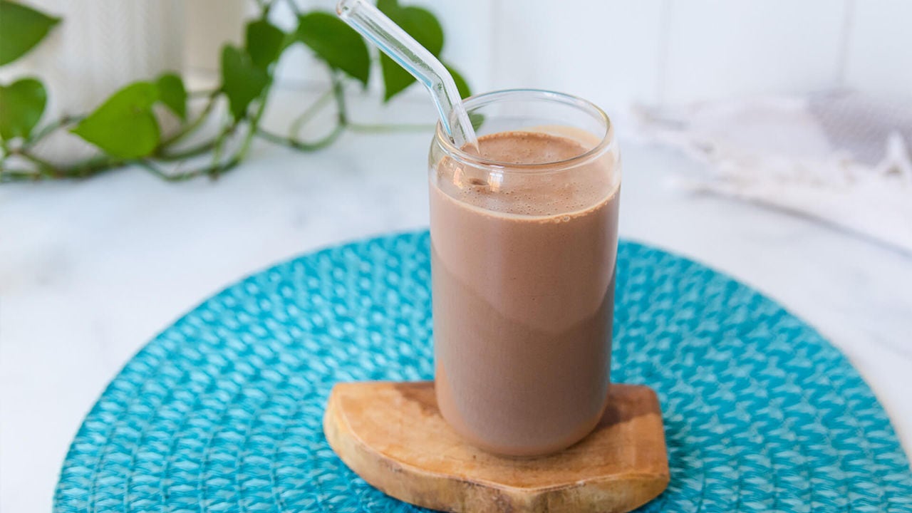 chocolate protein shake on wooden coaster