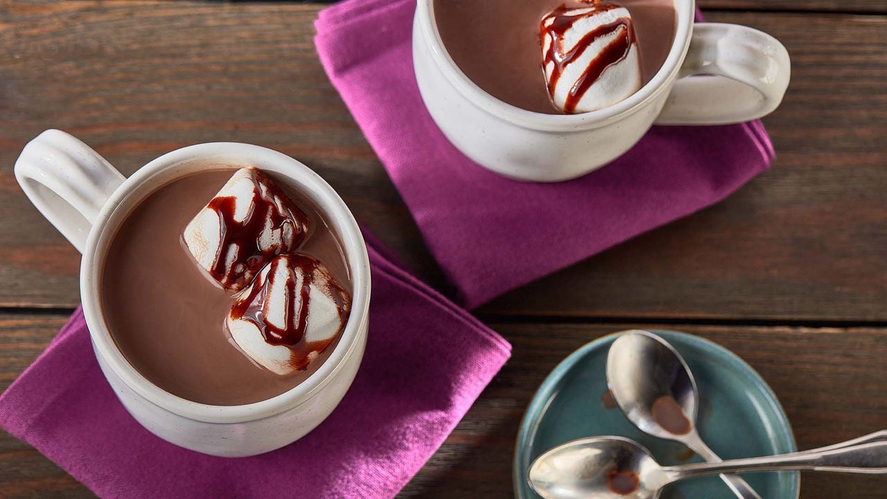 mugs of hersheys perfectly chocolate hot cocoa topped with marshmallows