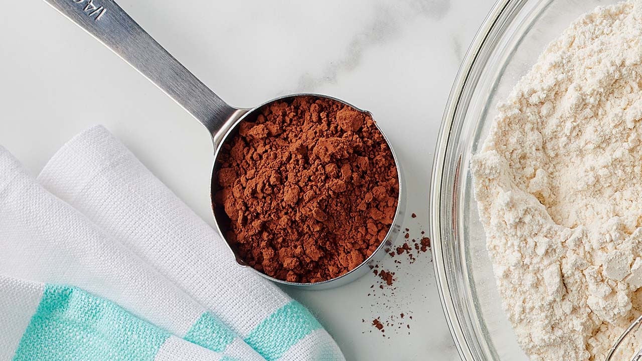 measuring cup full of cocoa powder