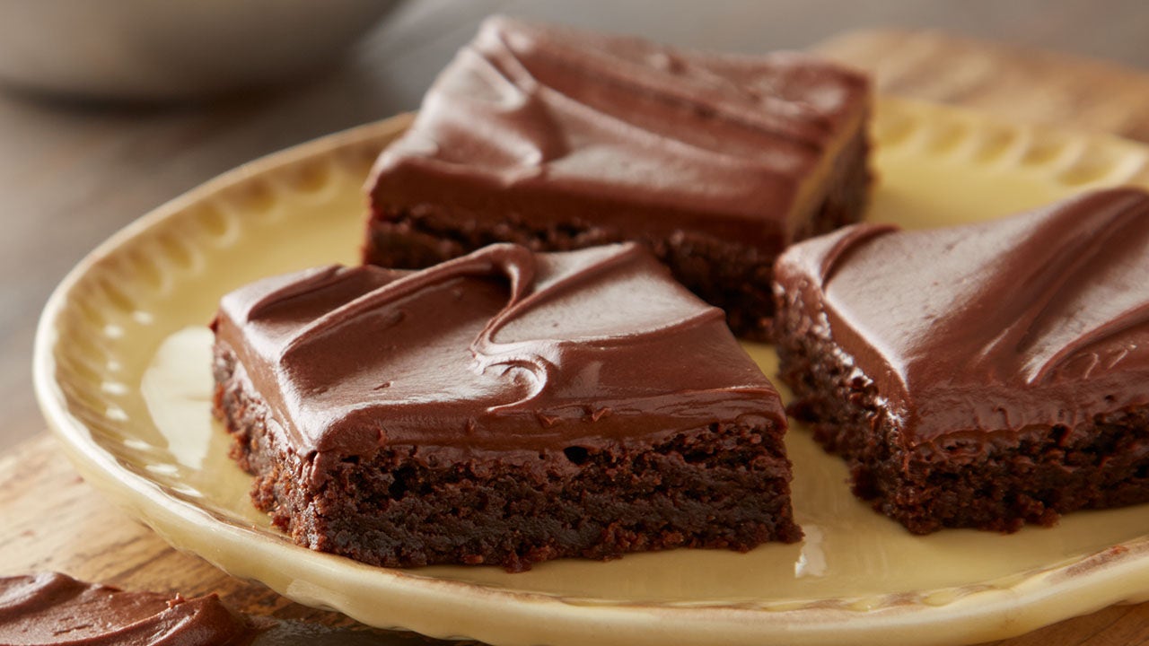 plate of frosted brownie squares