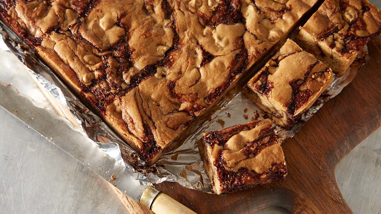 fresh brownies with peanut butter spread on top