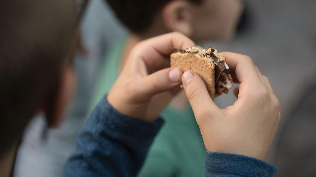 Person enjoying a smore