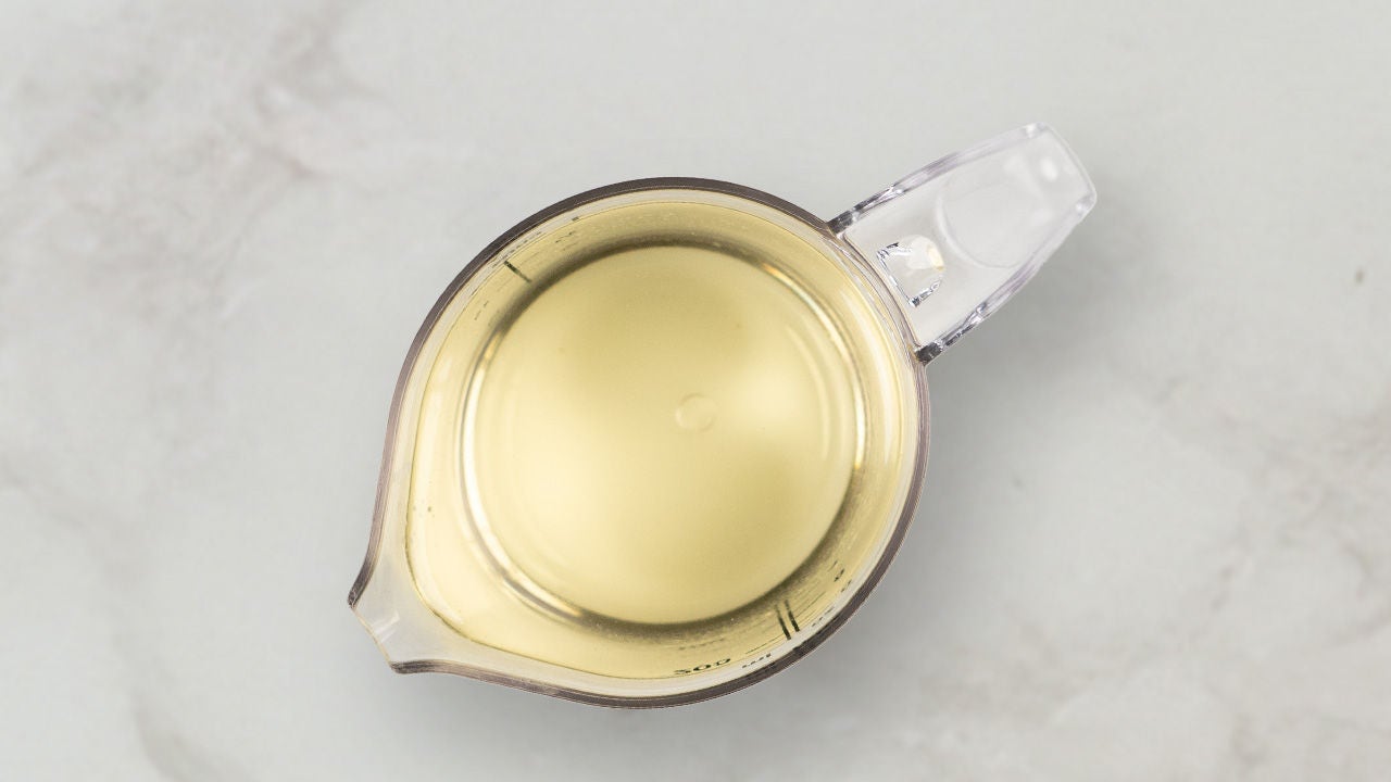 measuring cup filled with oil