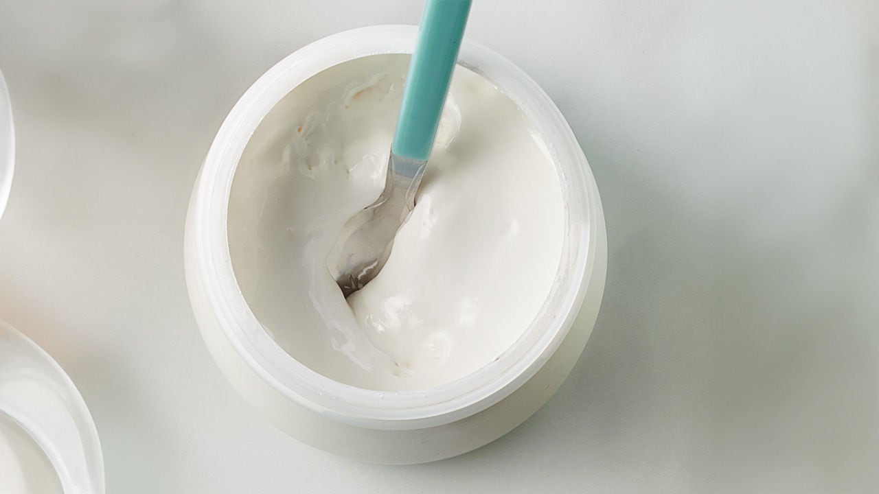 container of yogurt with spoon