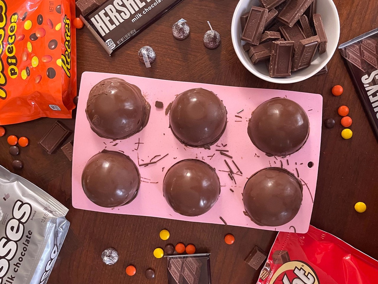 undecorated hot cocoa bombs in tray on table