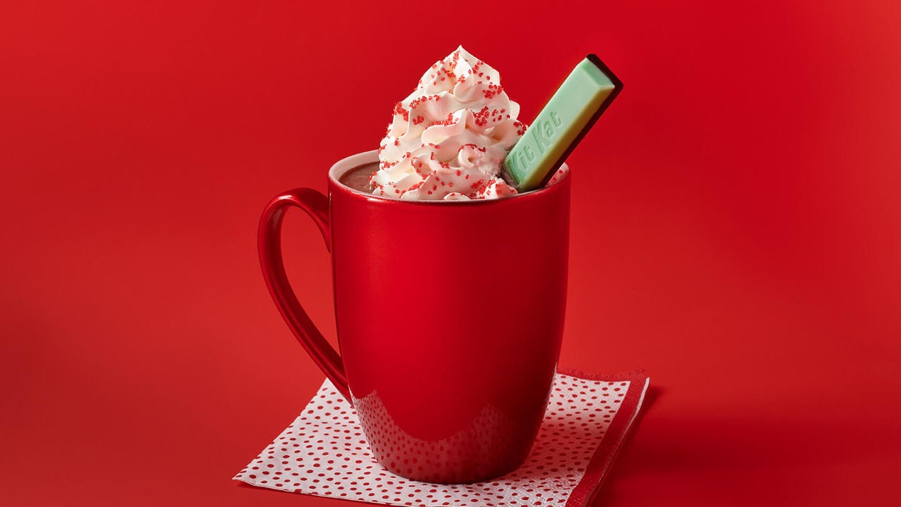 mug of mint chocolate hot cocoa topped with whipped cream