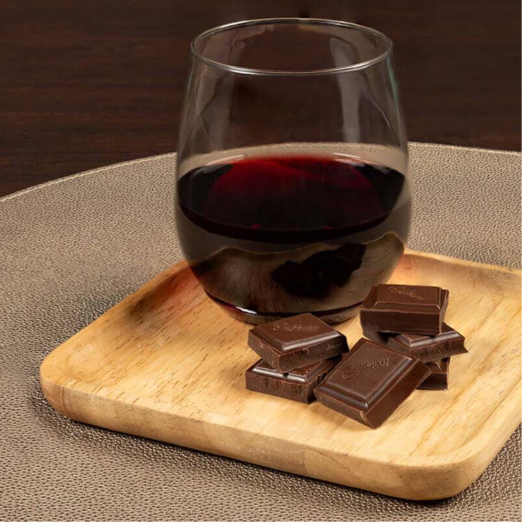 glass of cabernet sauvignon paired with cadbury royal dark chocolate candy