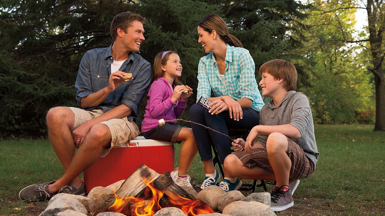 Family enjoying smores outside