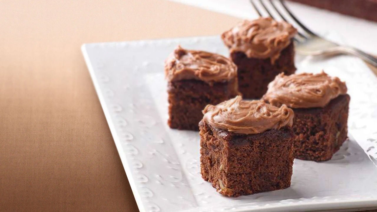 plate of iced chocolate syrup brownie squares