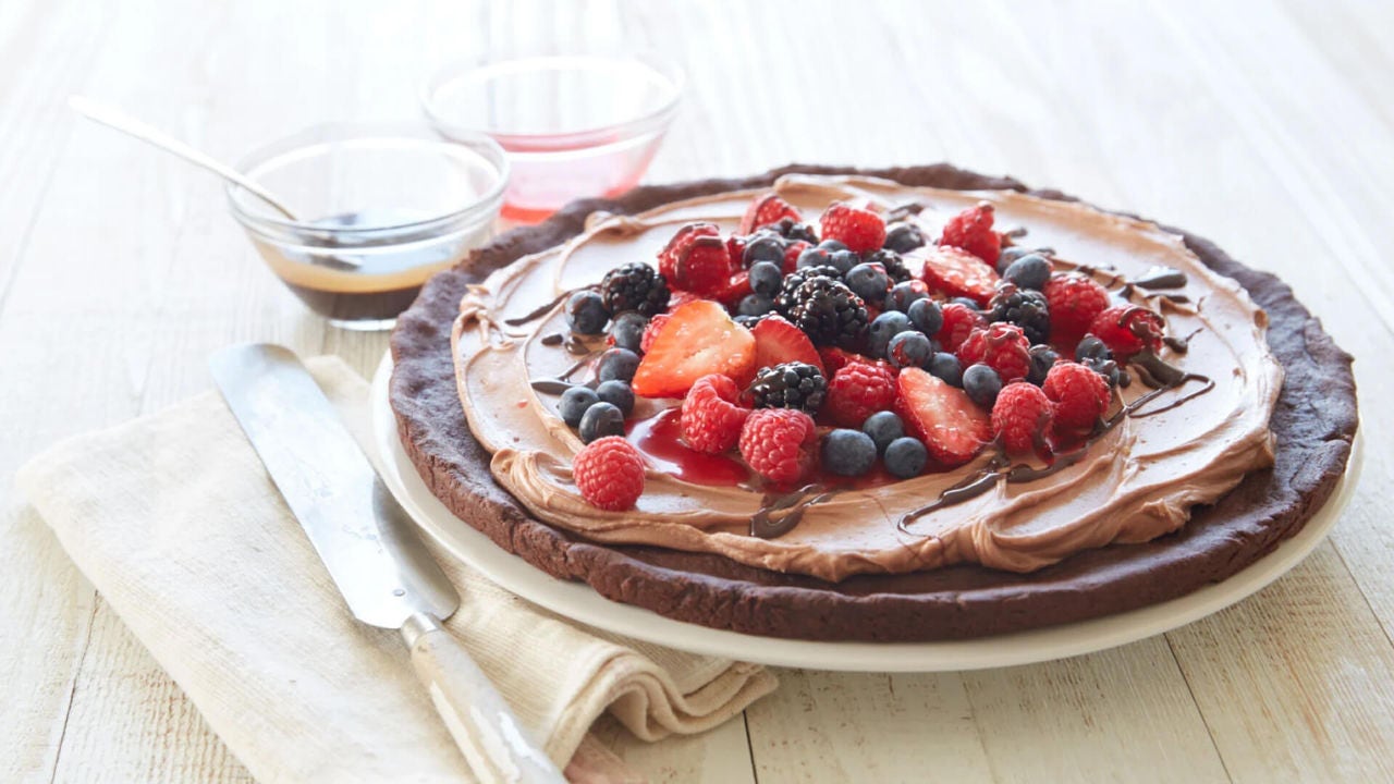 fudgey fruit pizza topped with fresh berries