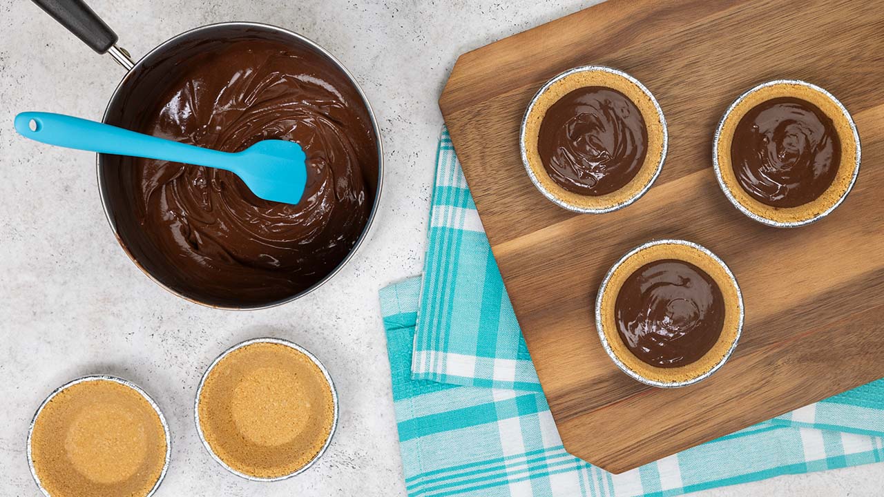 chocolate filling poured into pie crusts