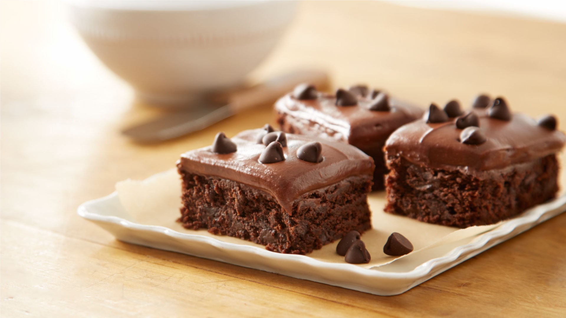 iced brownies on plate