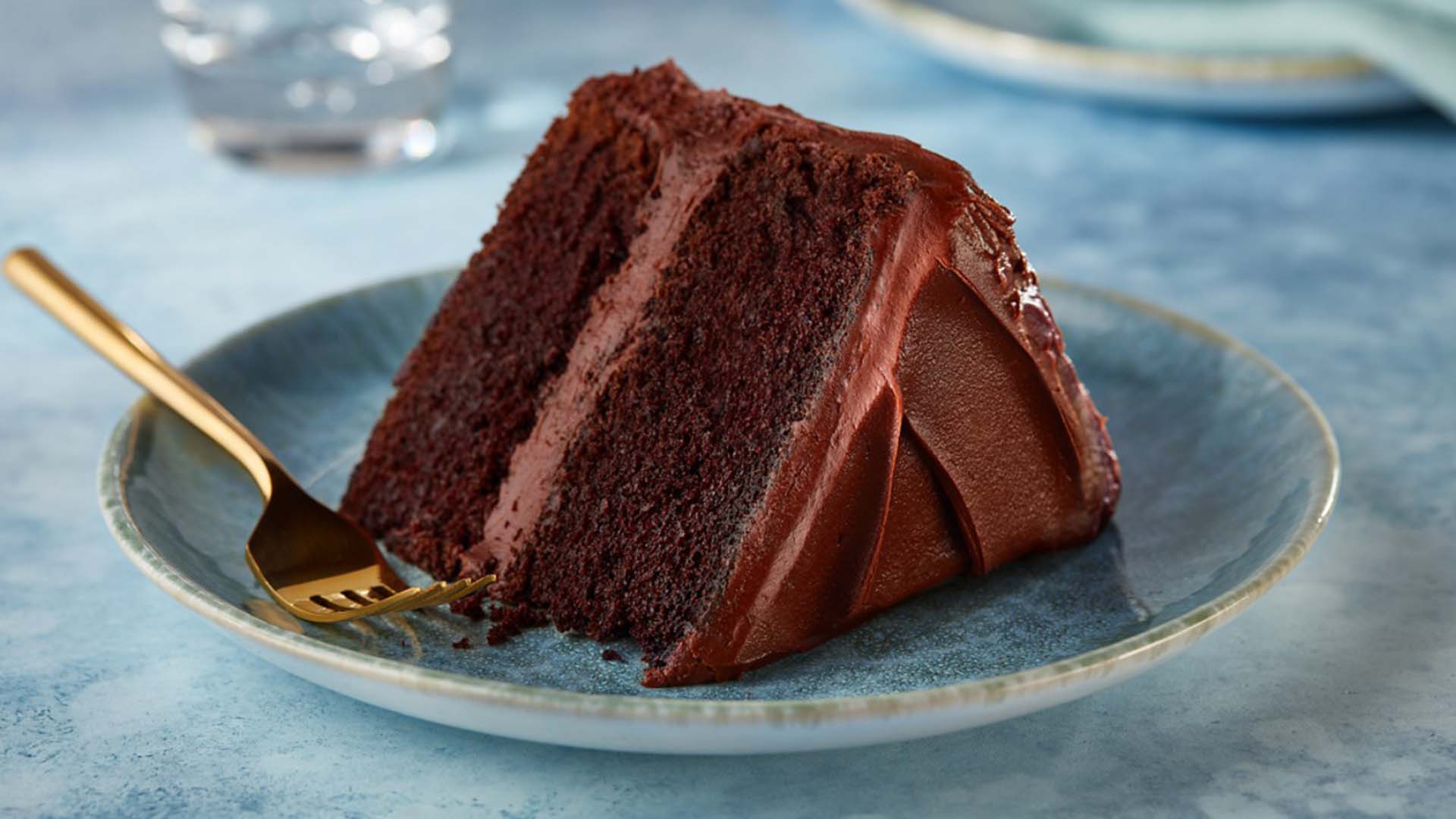 serving dish topped with a slice of hersheys perfectly chocolate cake