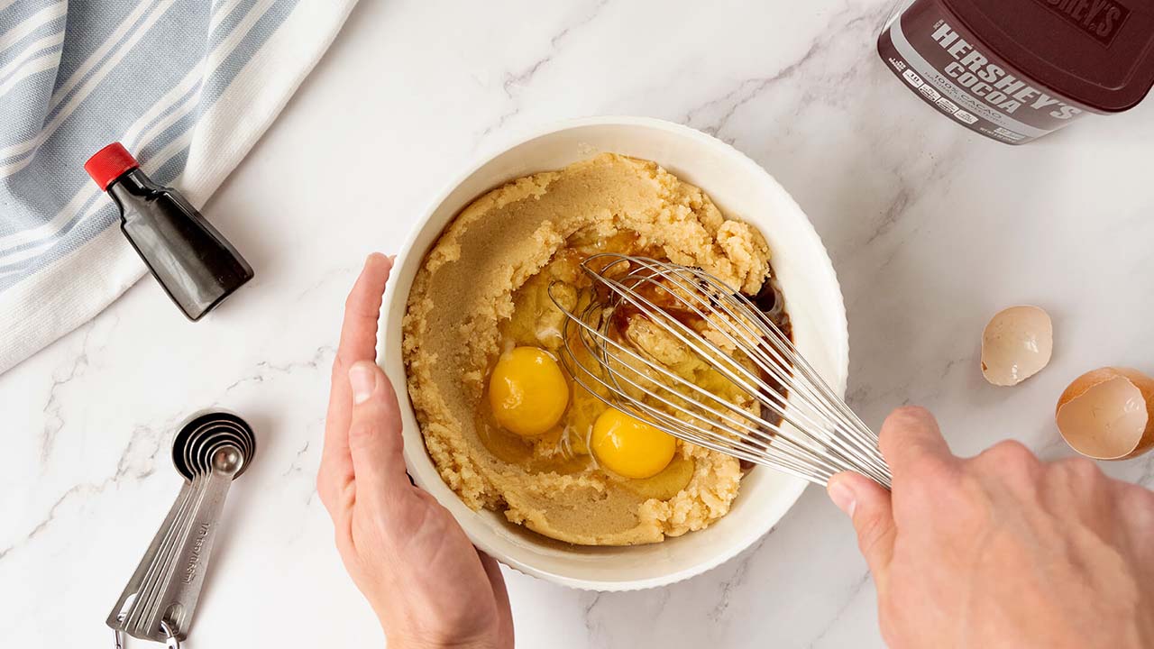 ingredients being whisked in a bowl