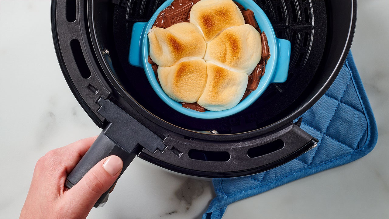 placing and baking the ramekin dish inside the air fryer