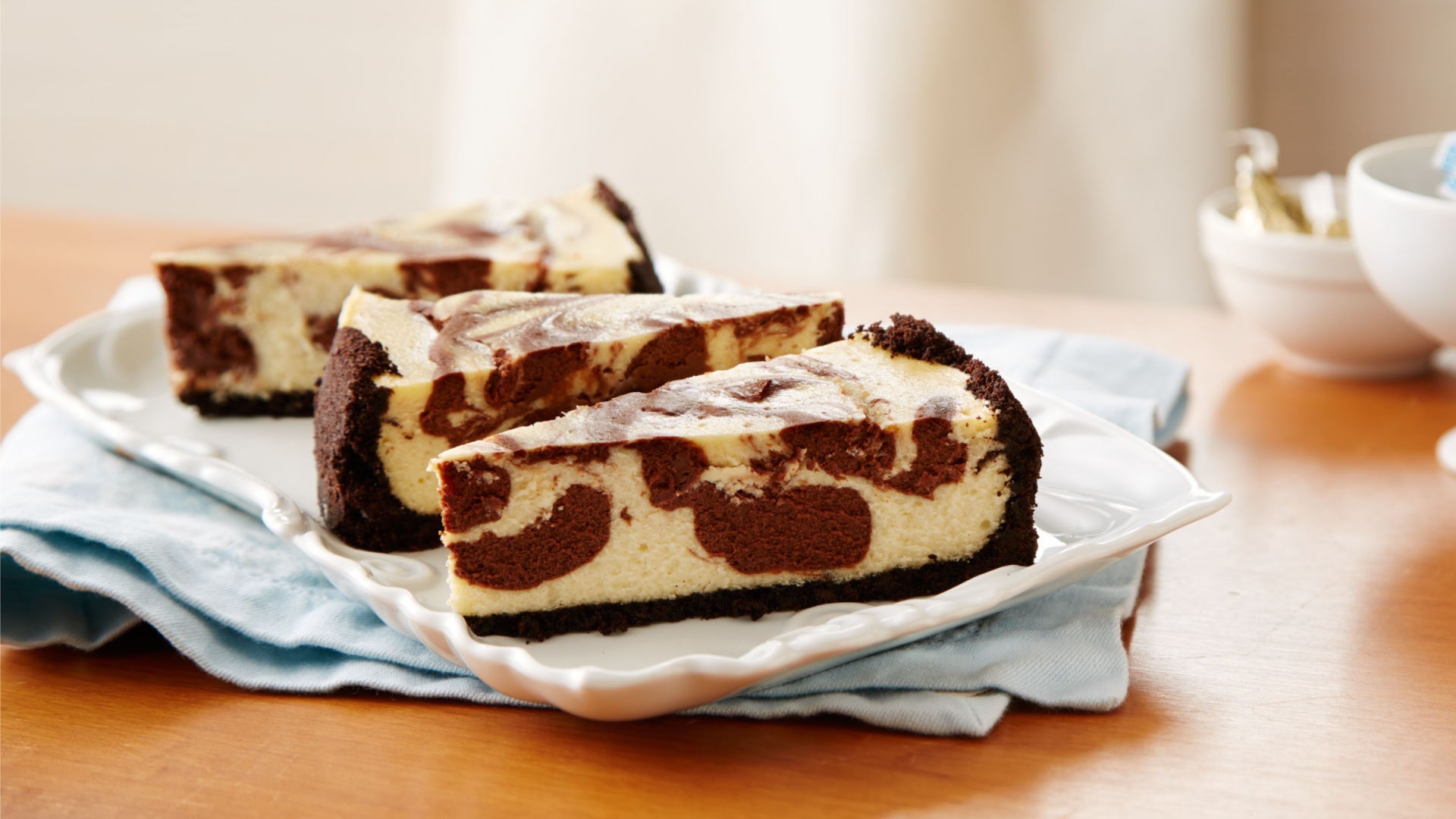 slices of chocolate swirled cheesecake on plate