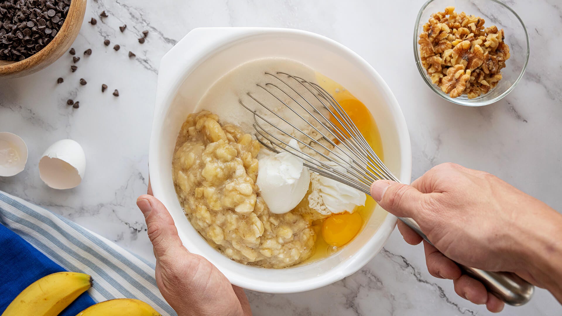 mixing dry and wet ingredients for banana bread