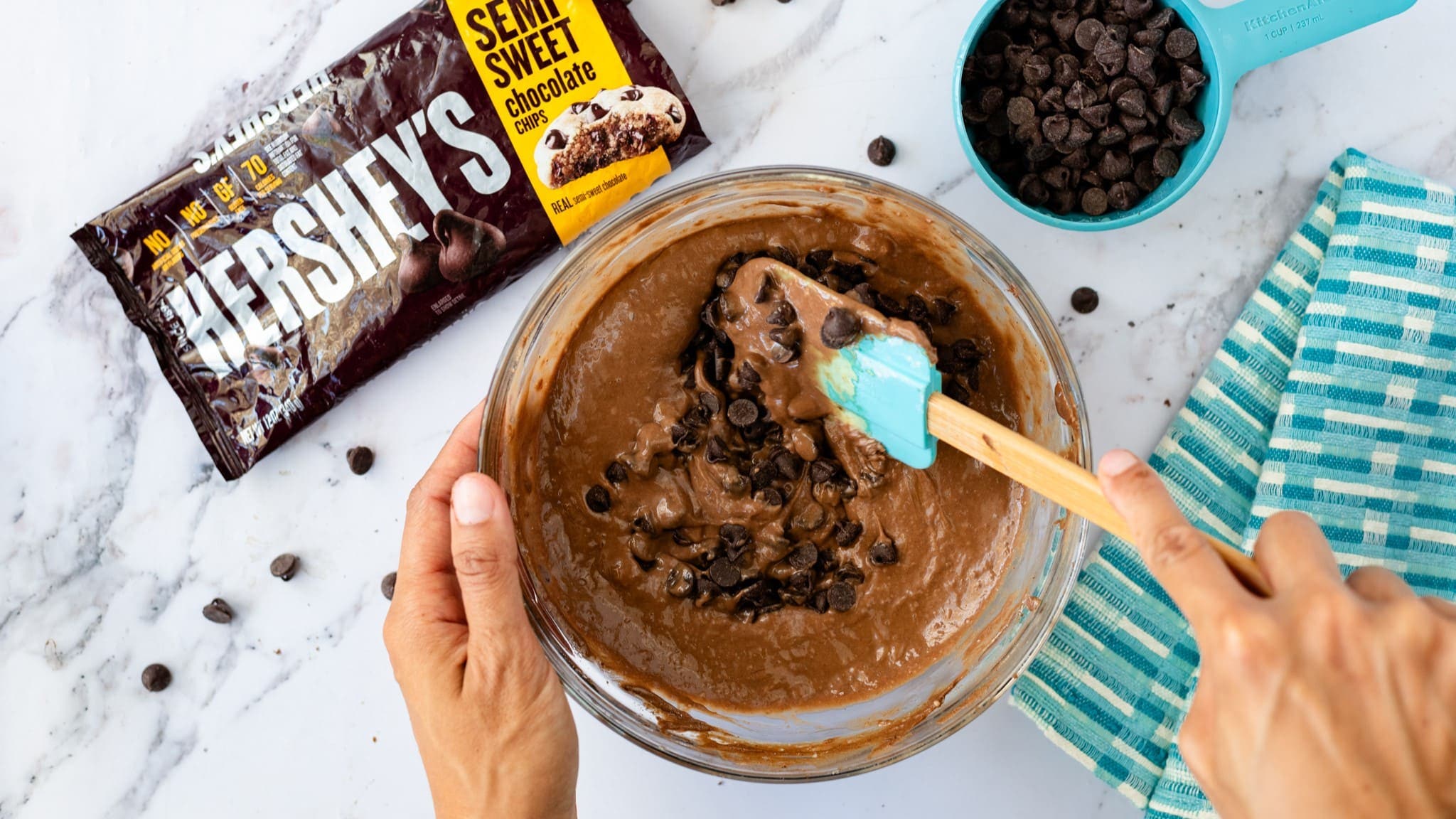 mini chocolate chips being mixed into batter