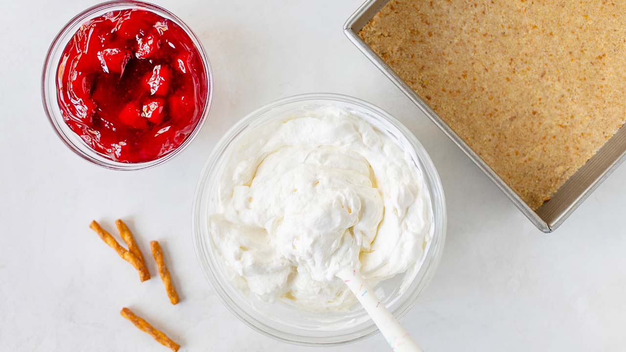 whipping together ingredients to make the cream cheese filling