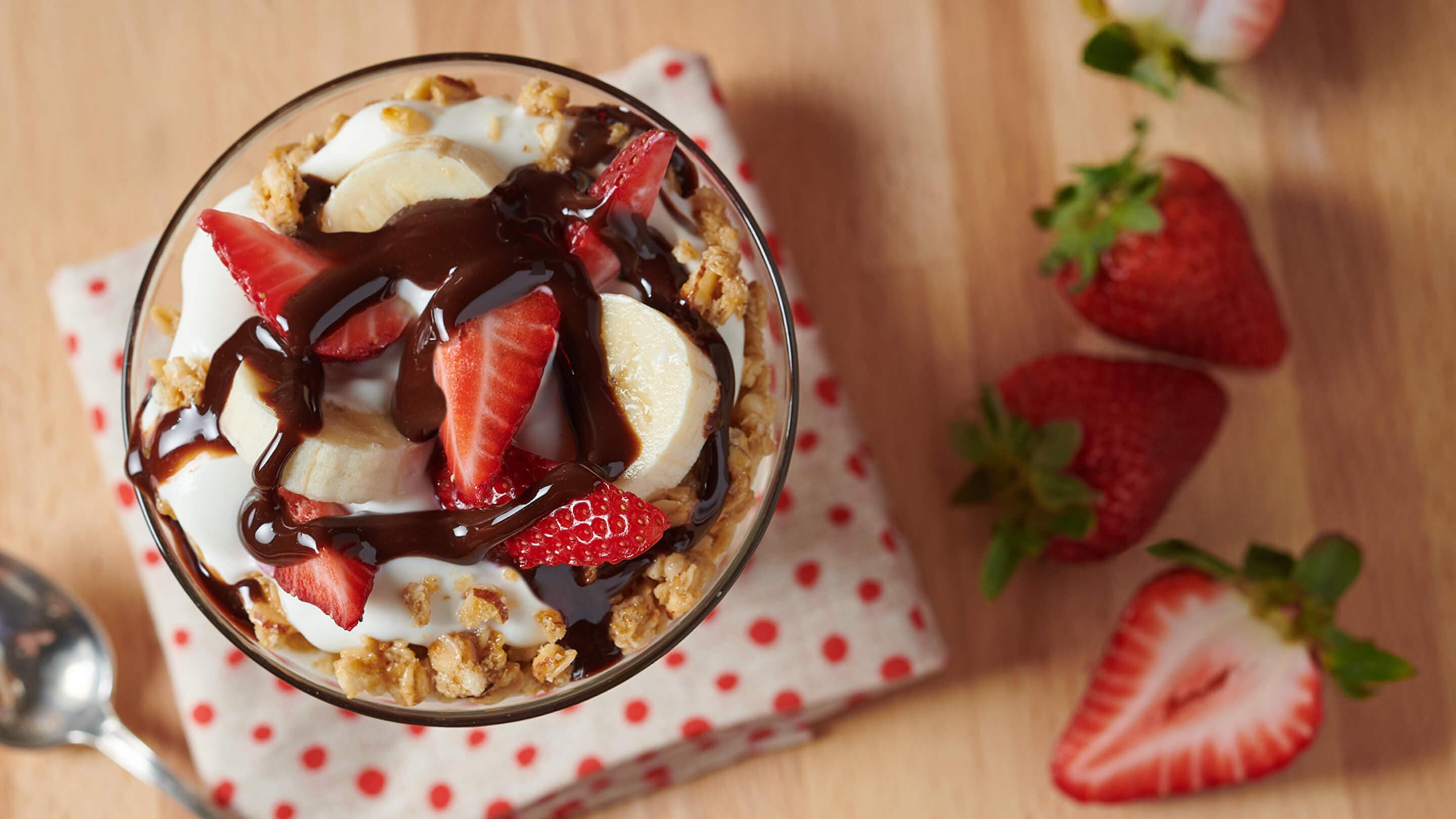 strawberry banana parfait drizzled with hersheys chcolate syrup