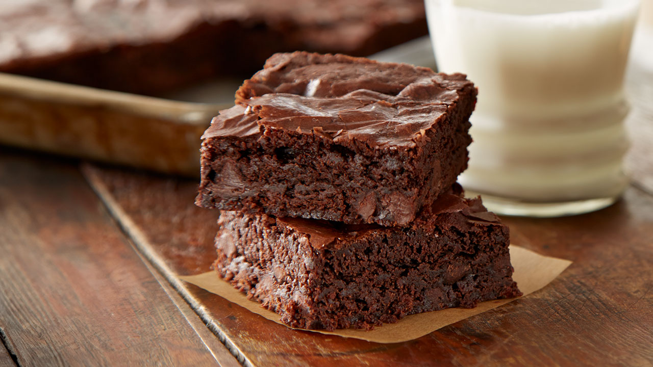 freshly baked brownies with glass of milk