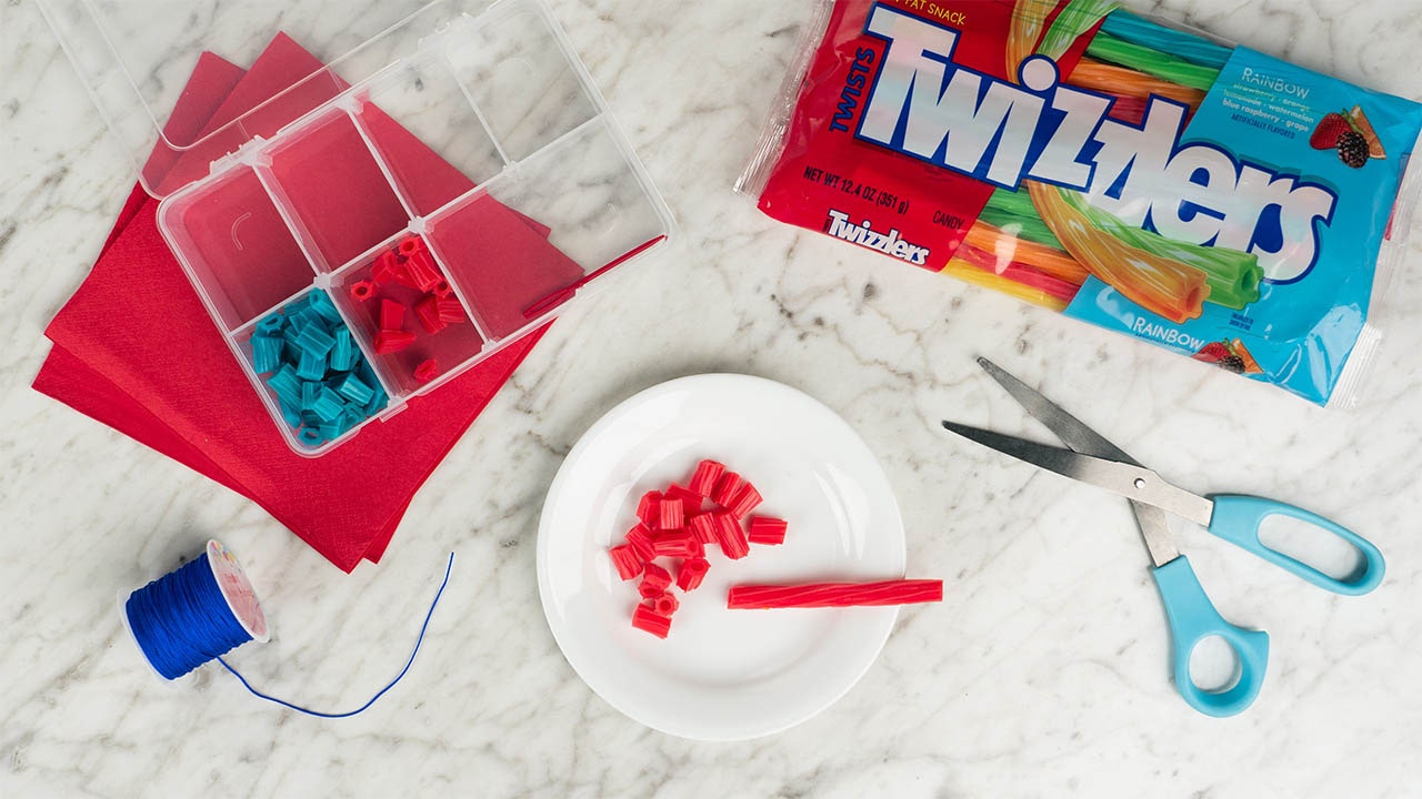 filling jewelry box with cut up candy pieces