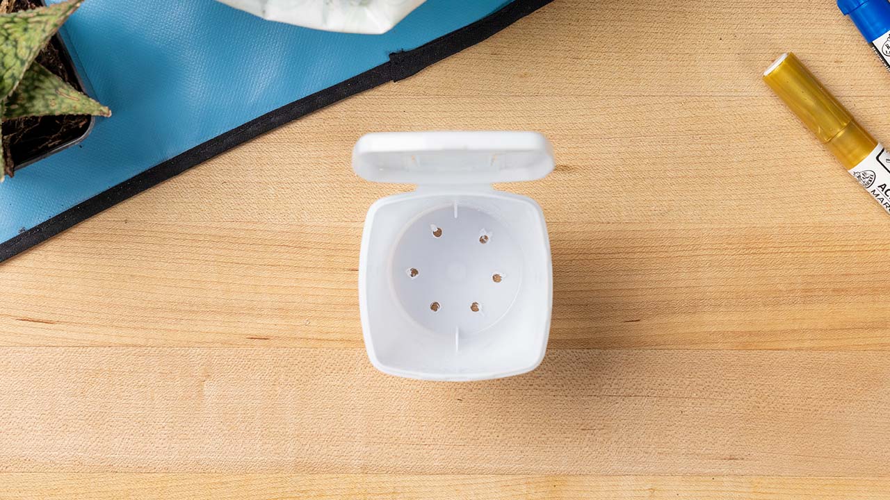 punching holes in the bottom of the ice breakers ice cubes container