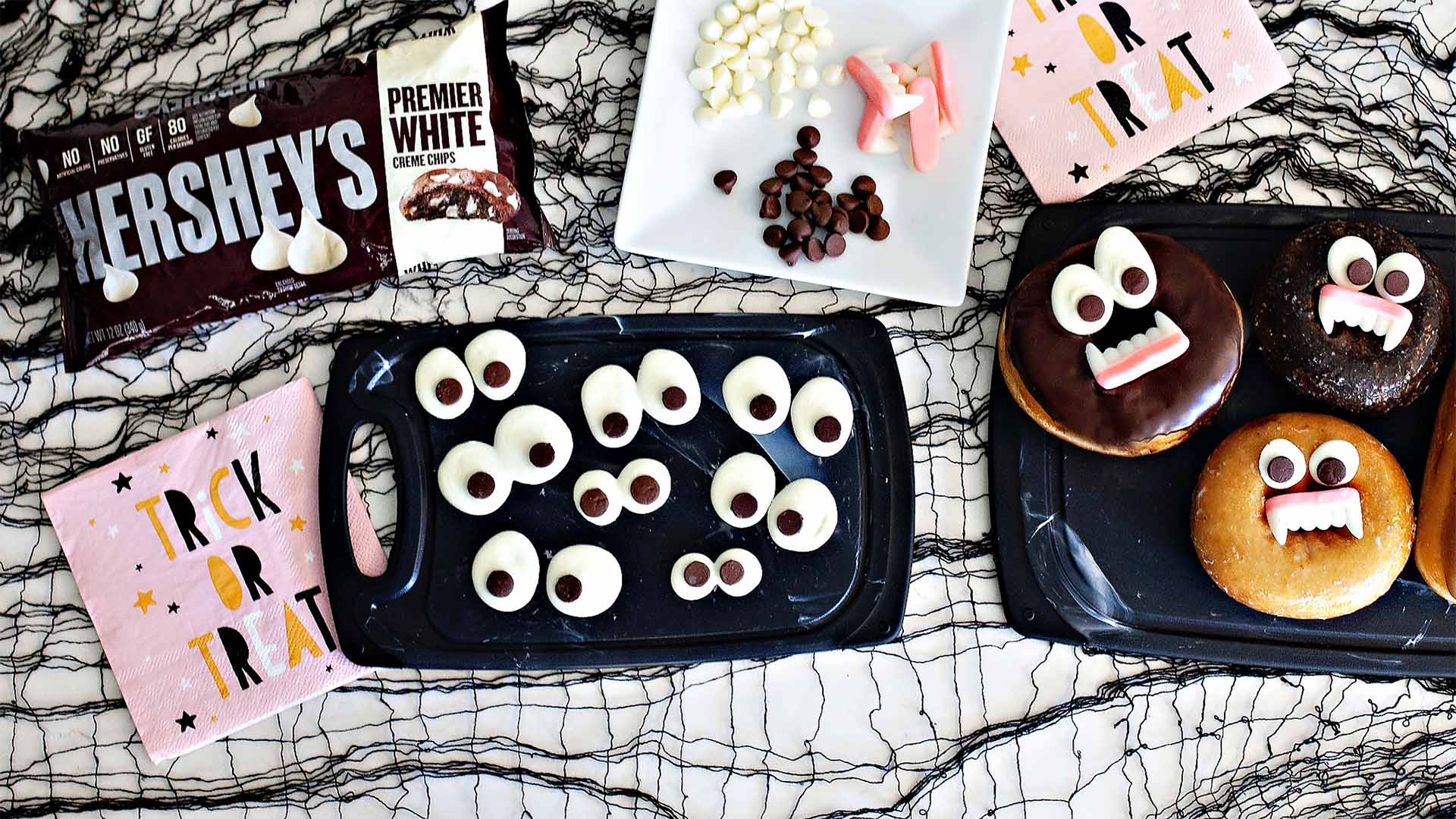 halloween themed donuts with ediible eyes and baking chips