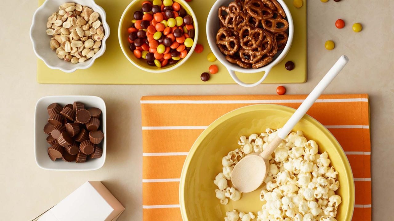 bowls of assorted trail mix ingredients for combining